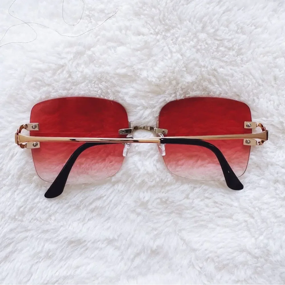 Laurel Clear Orange Rimless Sleek Sunglasses